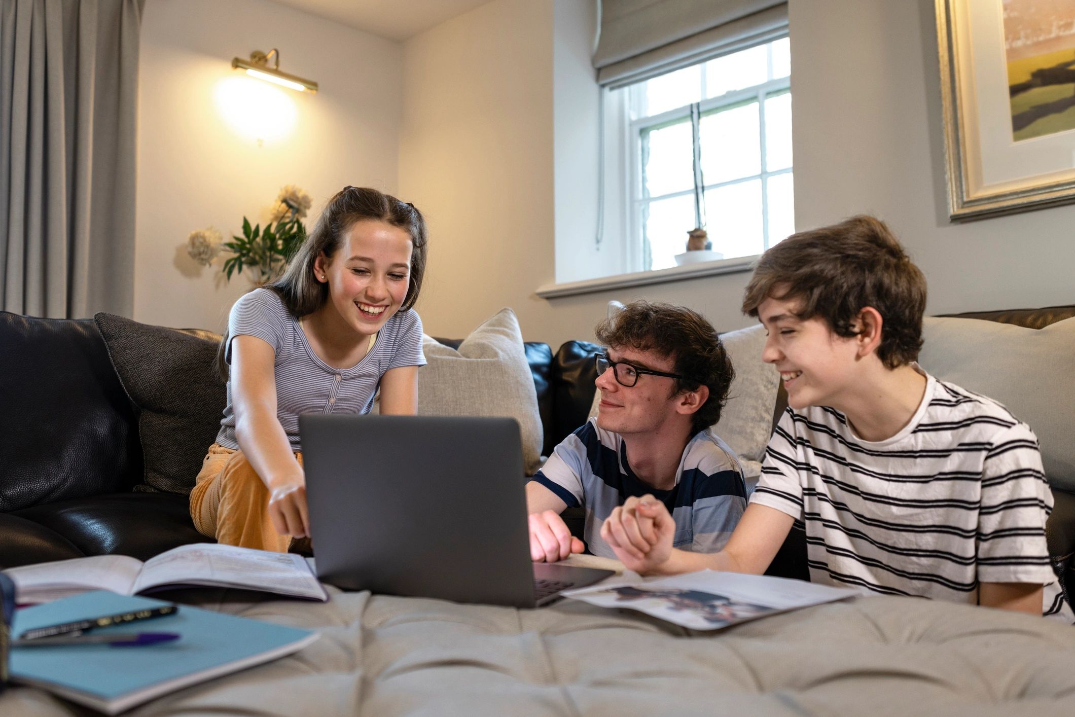Students learning together with a laptop